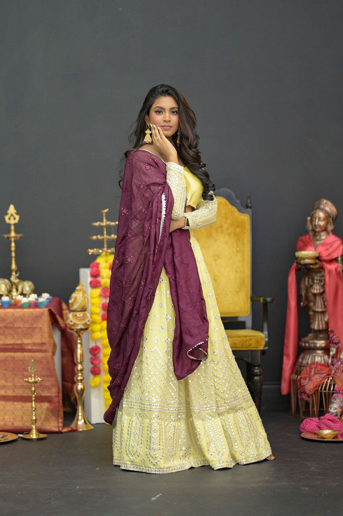 Pastel Yellow with maroon accents foil work lehenga